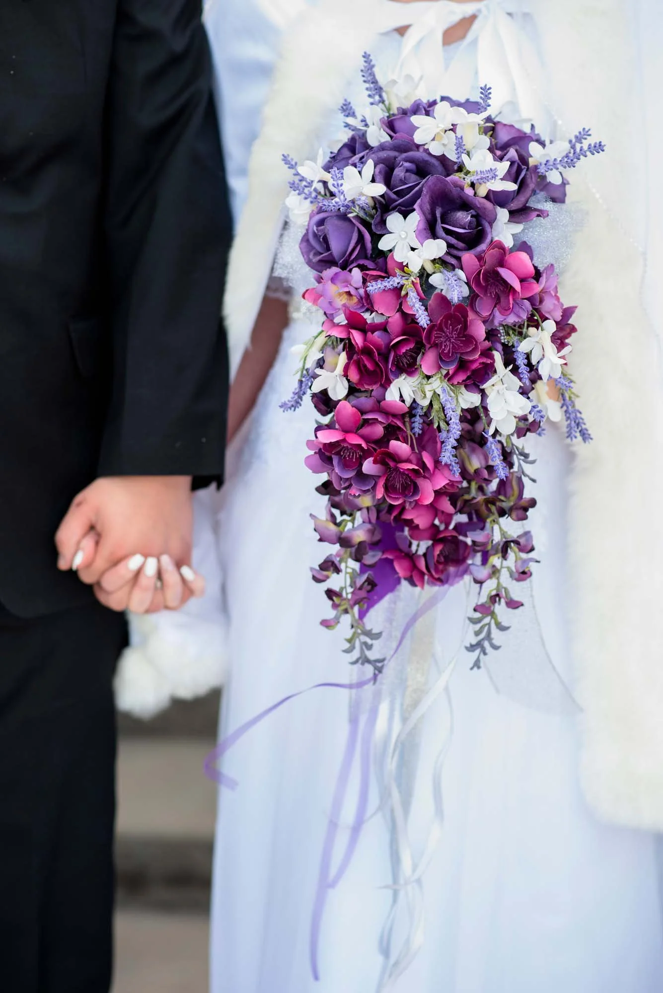 Winter-Wedding-Meridian-Idaho-Temple-Photographer-Bouquet-purple-hands.jpg