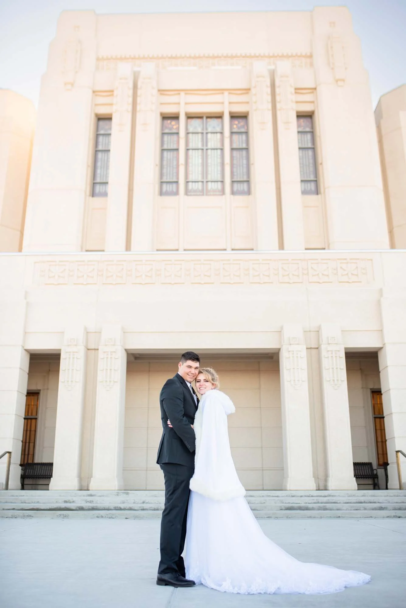 Winter-Wedding-Meridian-Idaho-Temple-Ada-County-Photographer-Bride-Groom-smiling.jpg