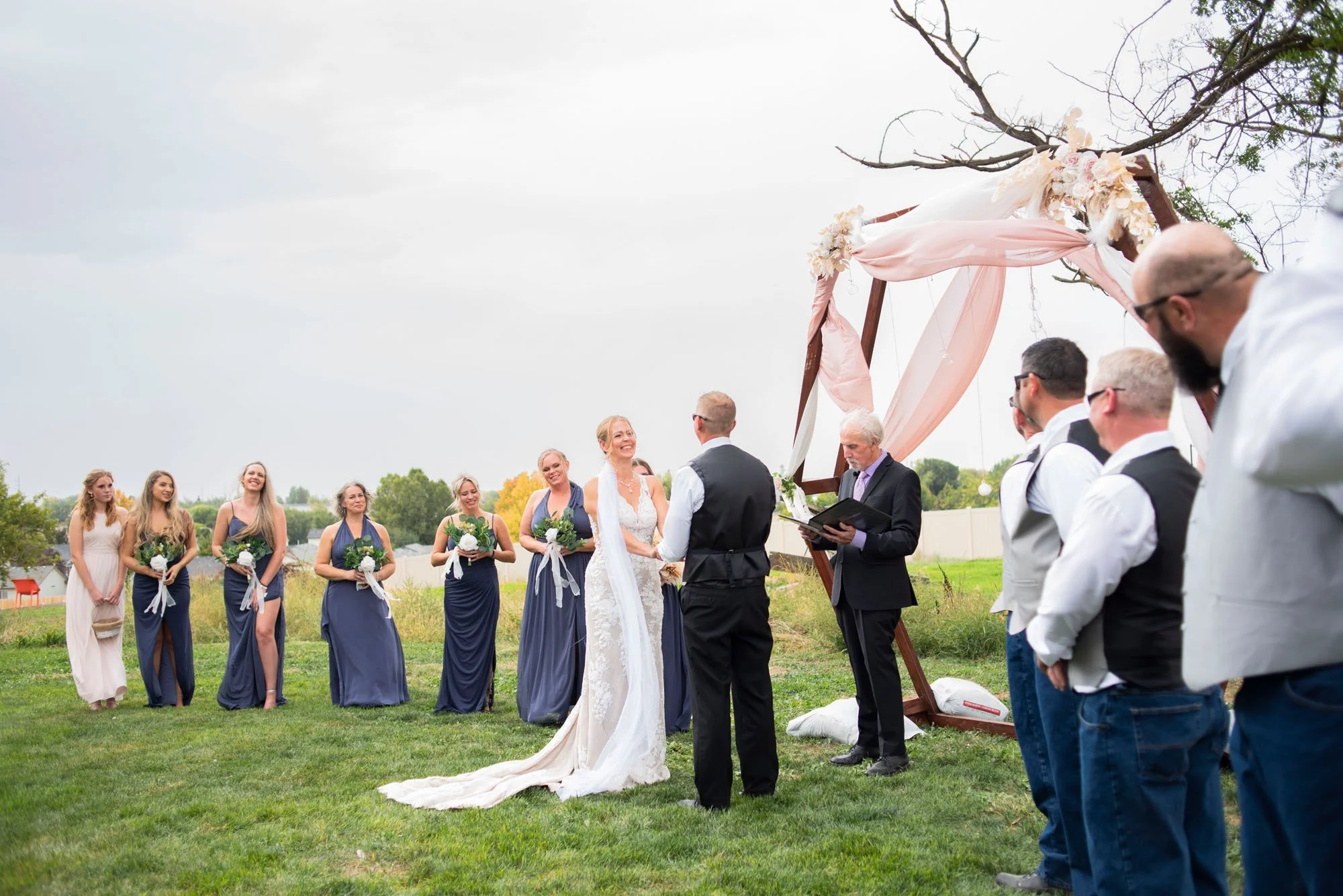 Firefly-Ranch-Idaho-Venue-Nampa-wedding-Ceremony-Outdoors-bride-groom-officiator.jpg