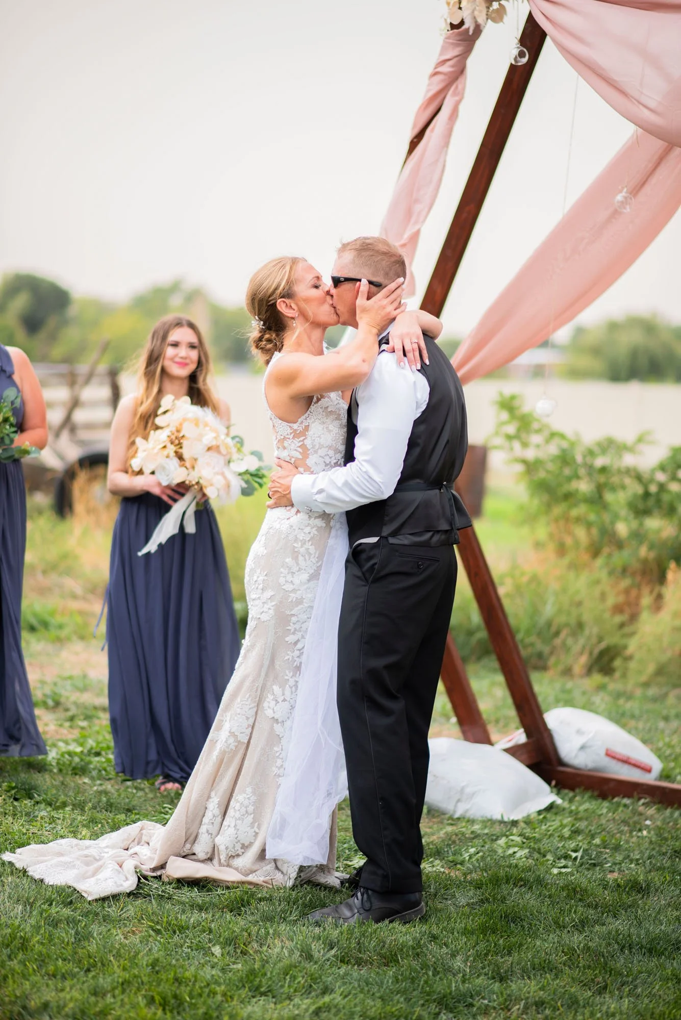 Firefly-Ranch-Idaho-Venue-Nampa-wedding-Ceremony-Outdoors-first-kiss-married.jpg