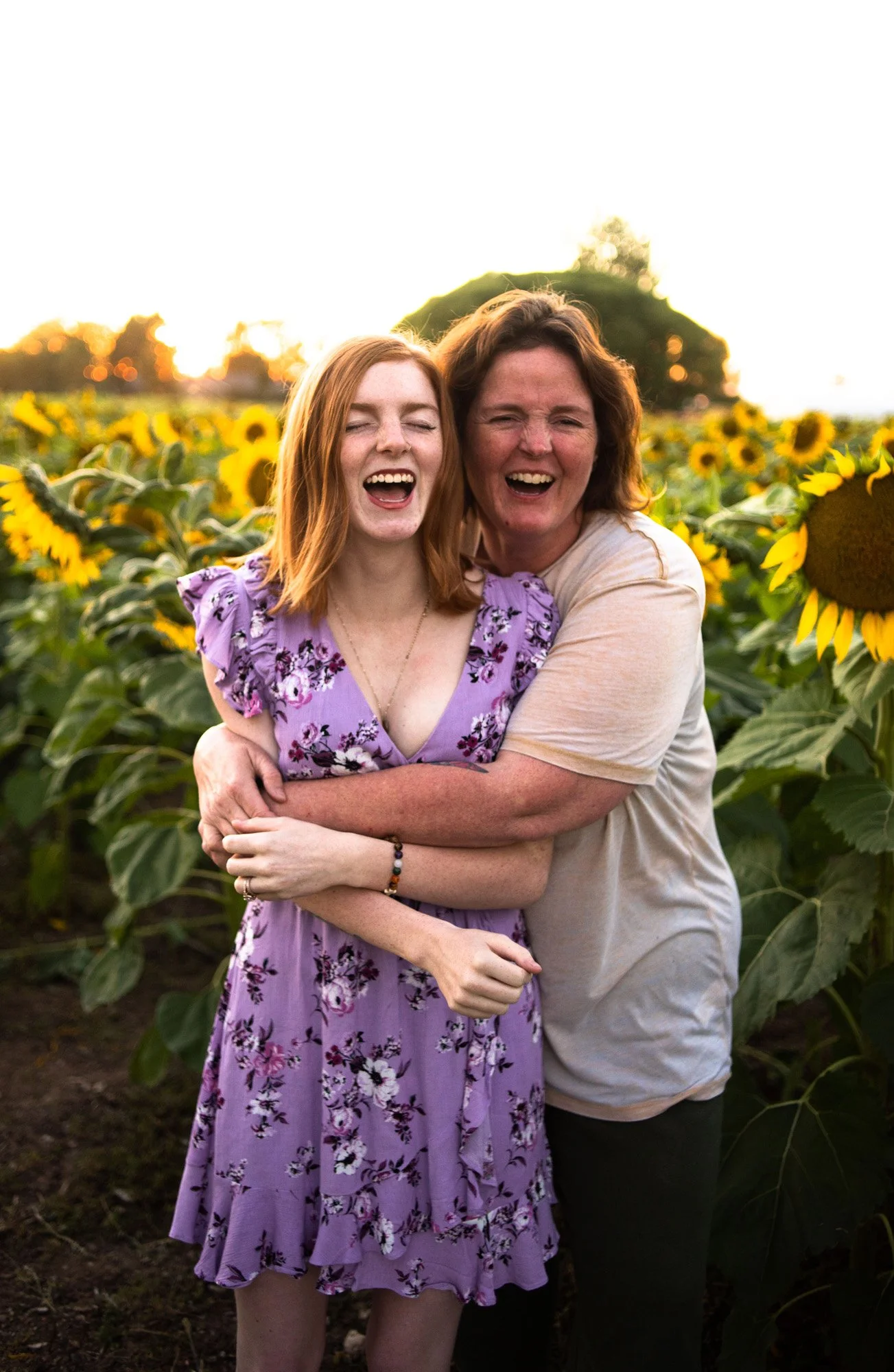 Mother-Daugther-laughing-Sunflower-Field-Meridian-Idaho-Photographer-Redhead-Senior-photos.jpg