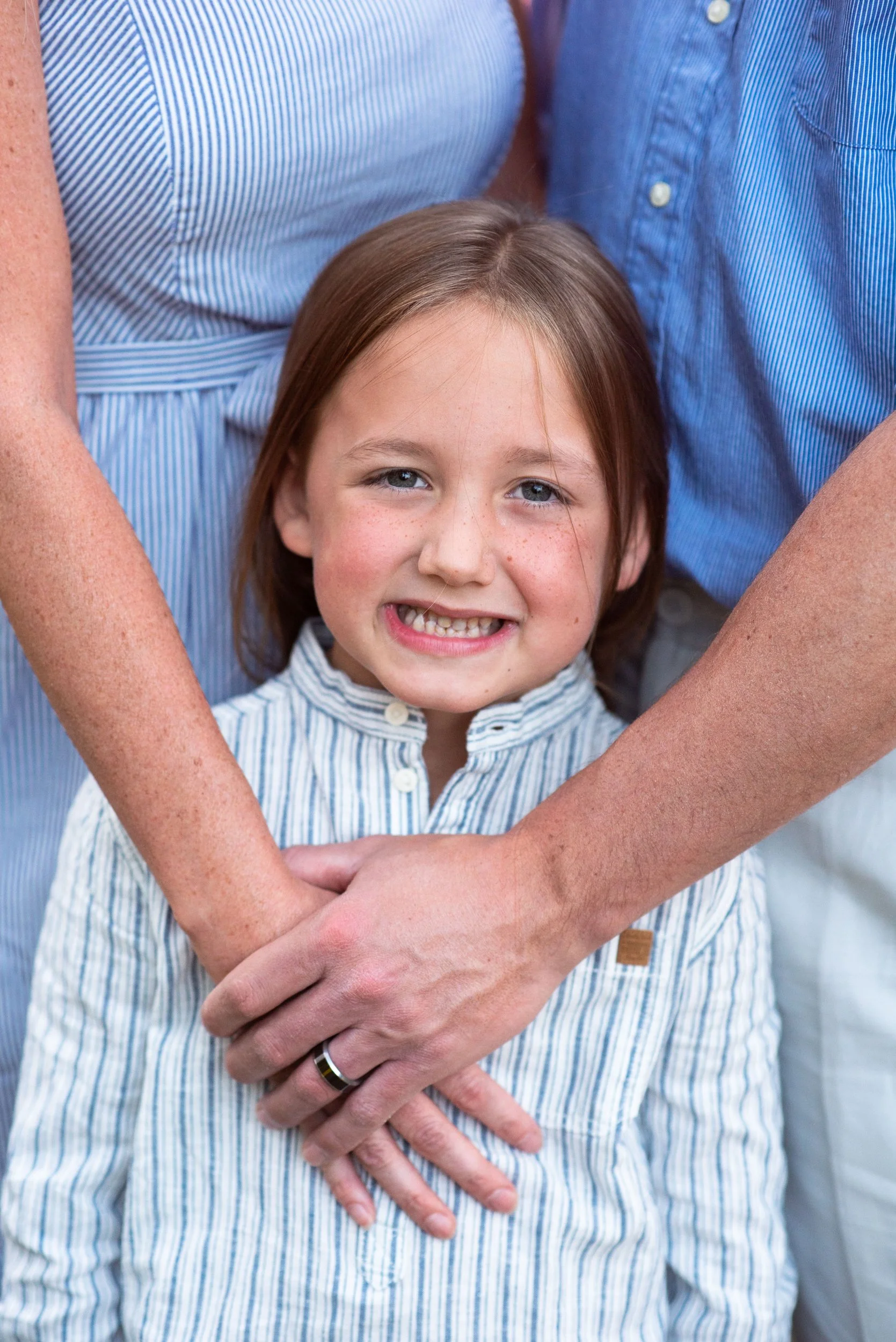 Boy-in-parents-arms-Mini-Sunflower-Photoshoot-Boise-photographer-Hannah-o-Hansen.jpg
