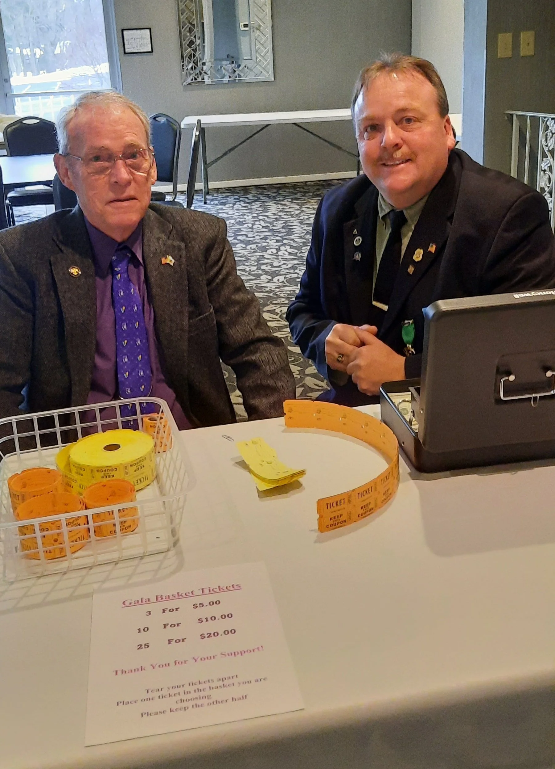 20260314_181749 Men Selling Raffle Tickets.jpg