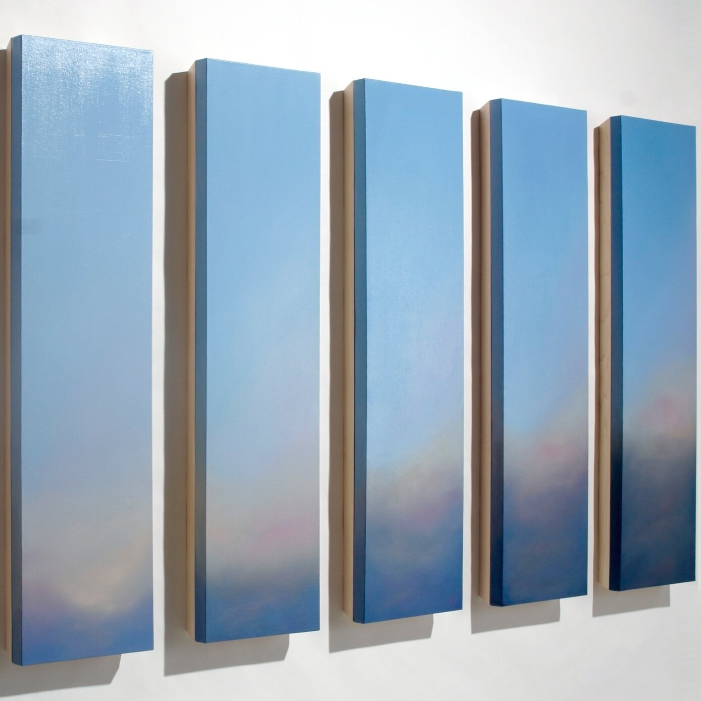 A soft setting sky by Marietta Patricia Leis. Pictured here, 5 out of 6 panels from the work Quivers, oil on canvas, 48 x 12 x 3.75&Prime; each.⁠
.⁠
DM for additional information and images of all 6. ⁠
.⁠
#fineart #art #contemporarypainting #contempo