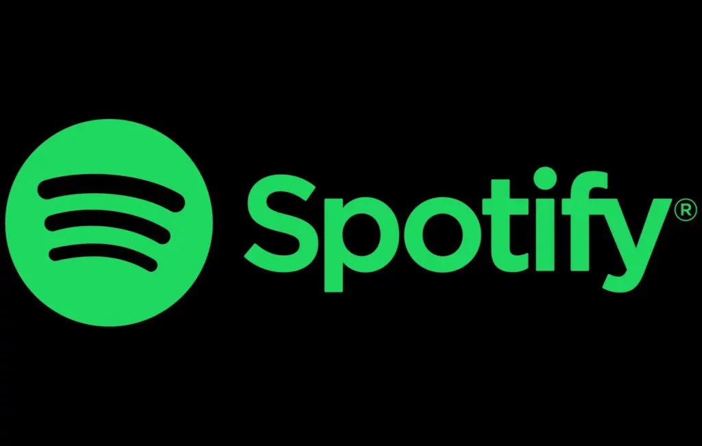 Spotify logo with green circle and black sound waves, and the word 'Spotify' in green text on a black background.
