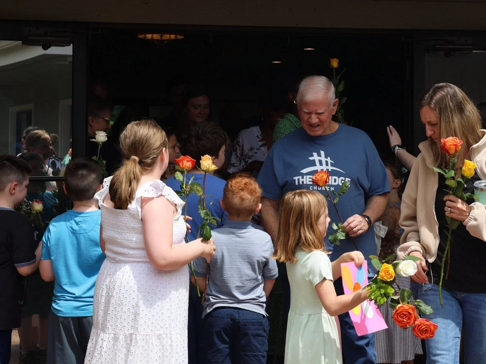 Bridge Kids families greeting one another after a service