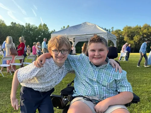 Students playing together on the church lawn