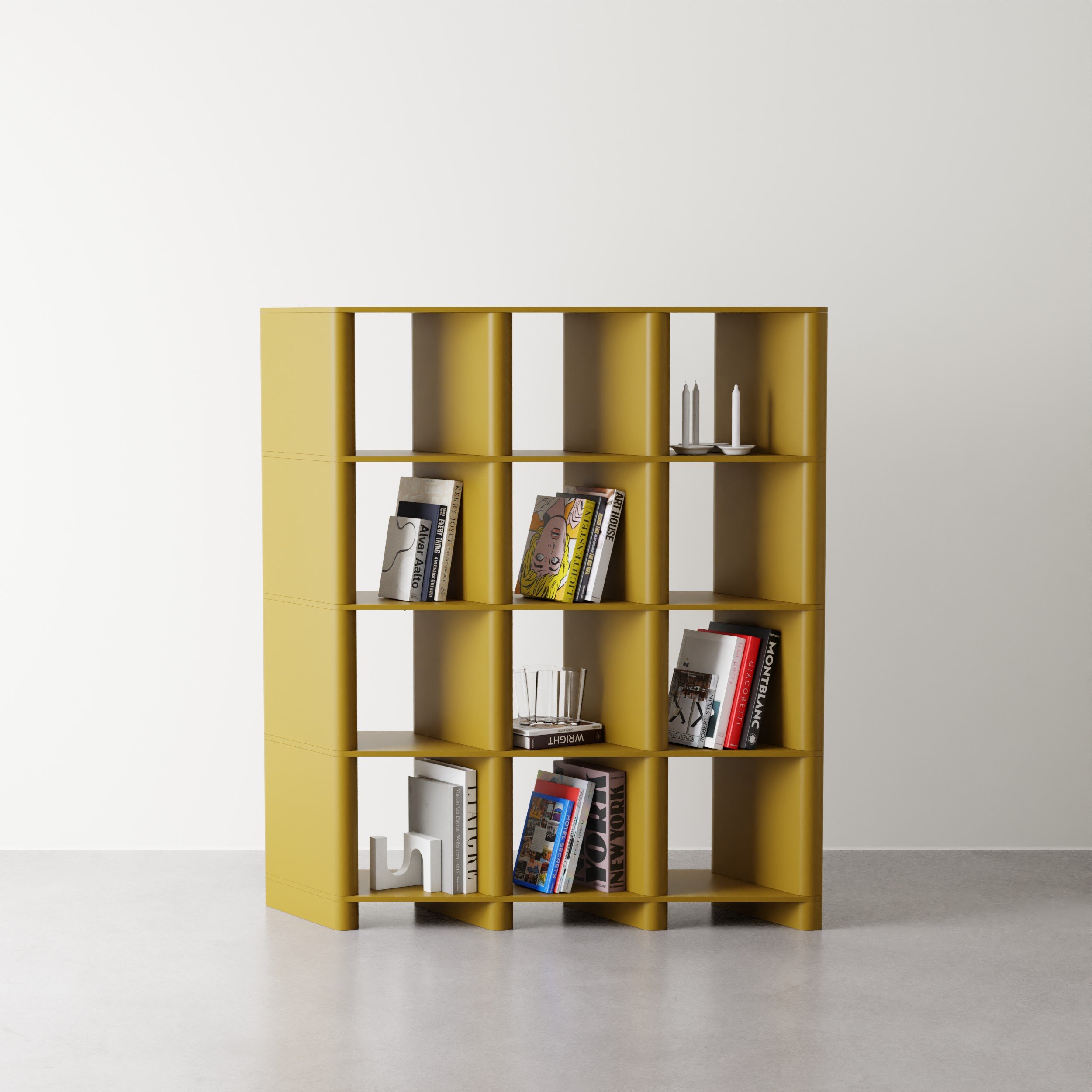 A yellow bookshelf with multiple compartments containing books and decorative items, set against a plain white wall.