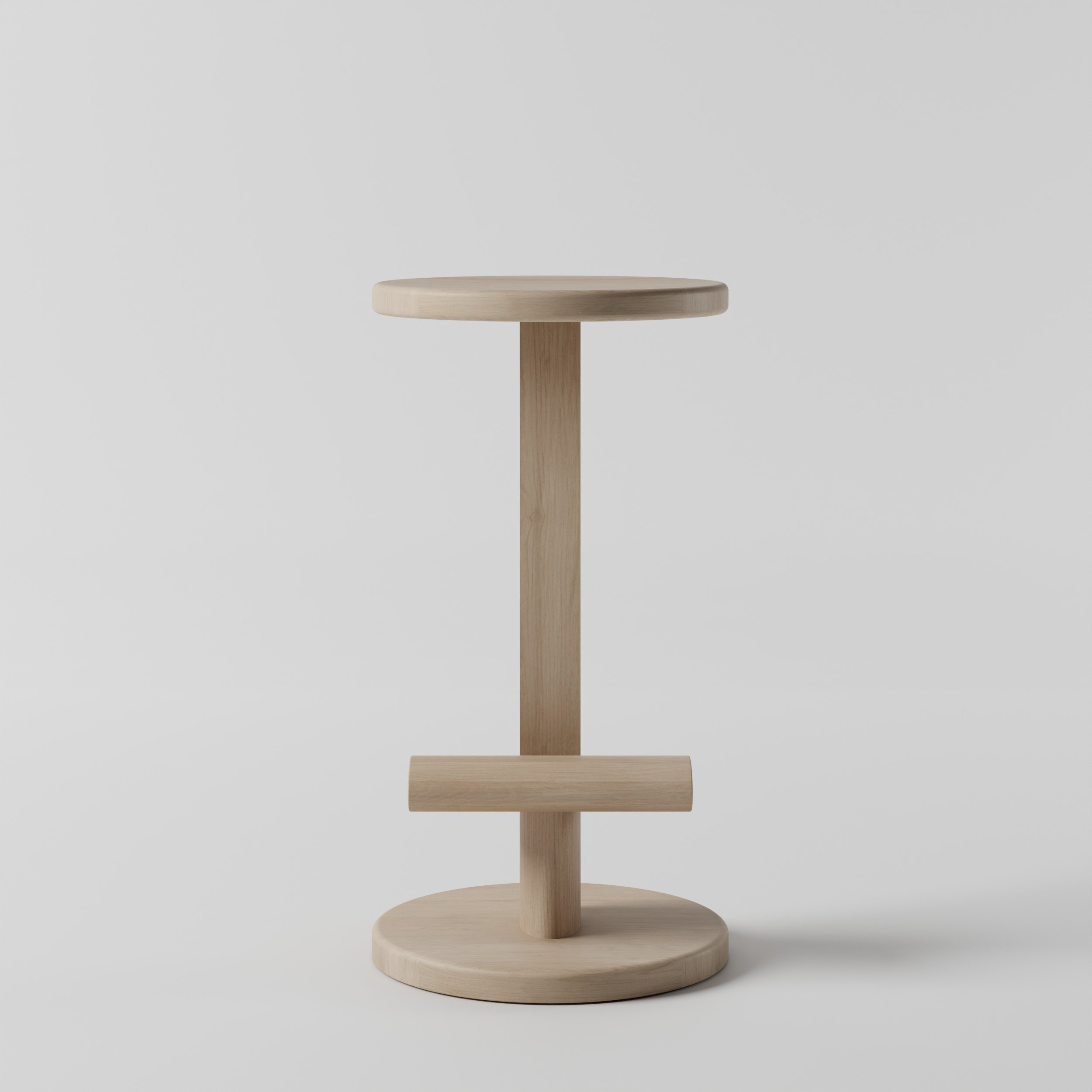 Wooden barstool with a round top and a supporting column, set against a plain white background.