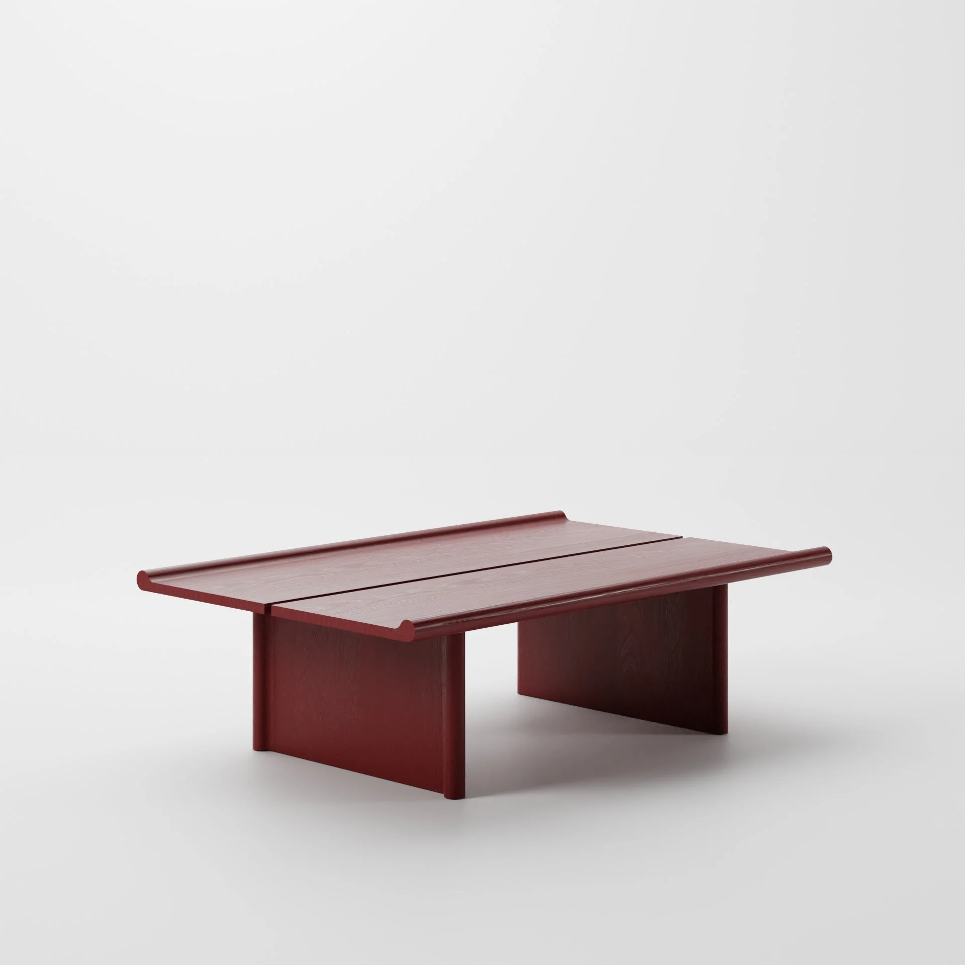 A wooden table with a red finish against a plain white background.