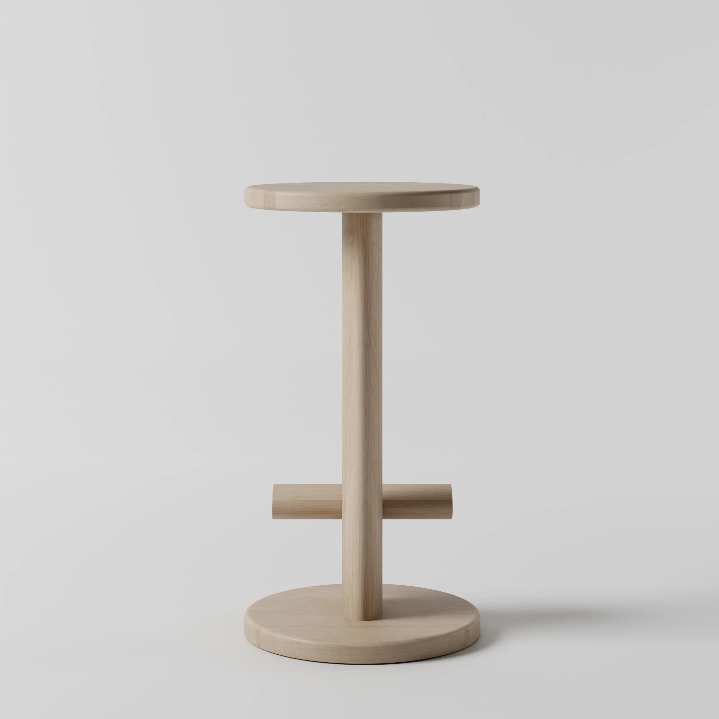 Light wooden barstool with round top, vertical support, and flat circular base, set against a plain gray background.