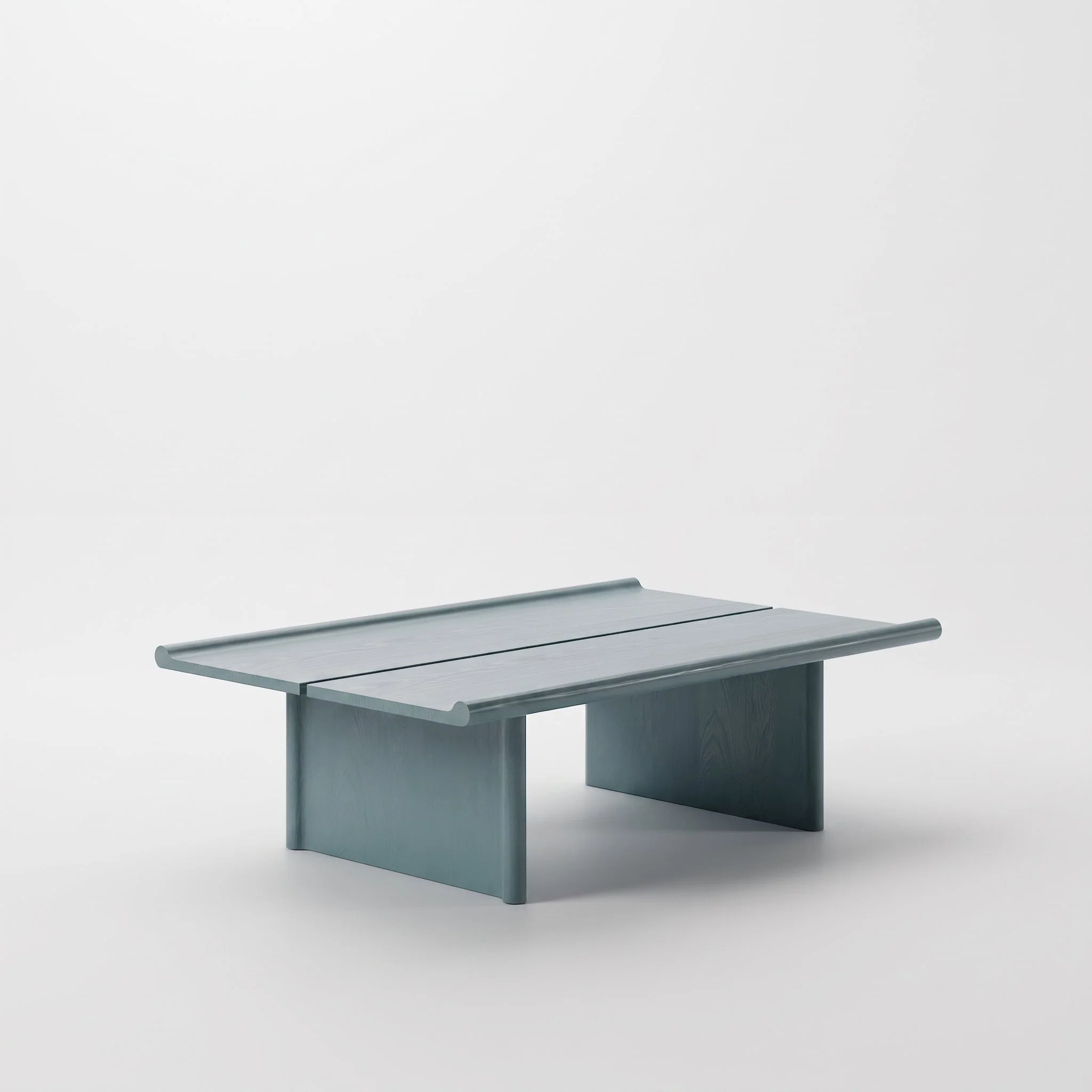 A modern, minimalist desk with a sleek, gray metal surface and matching legs, set against a plain white background.
