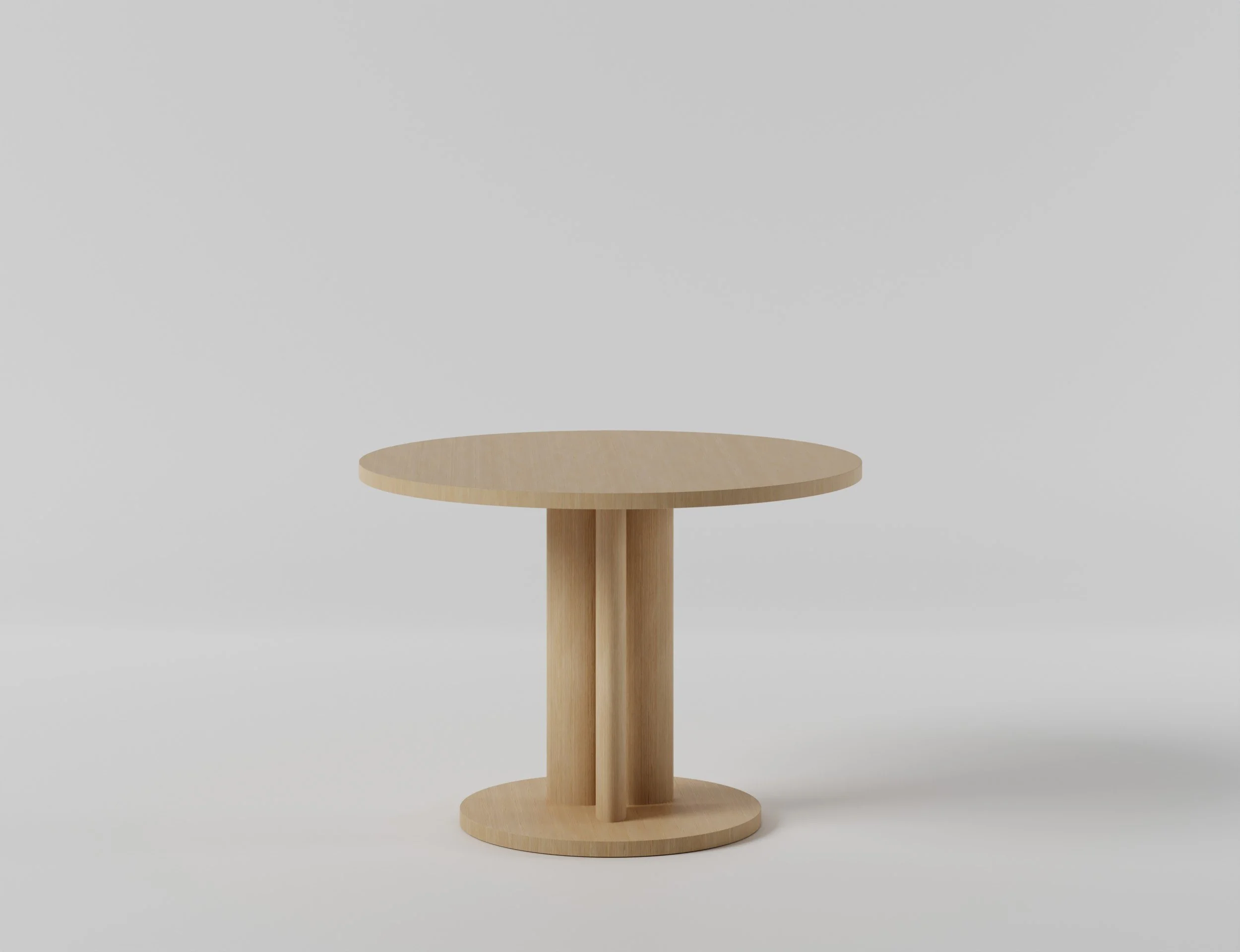 A simple round wooden side table with a vertical support and a flat circular surface, set against a plain light gray background.