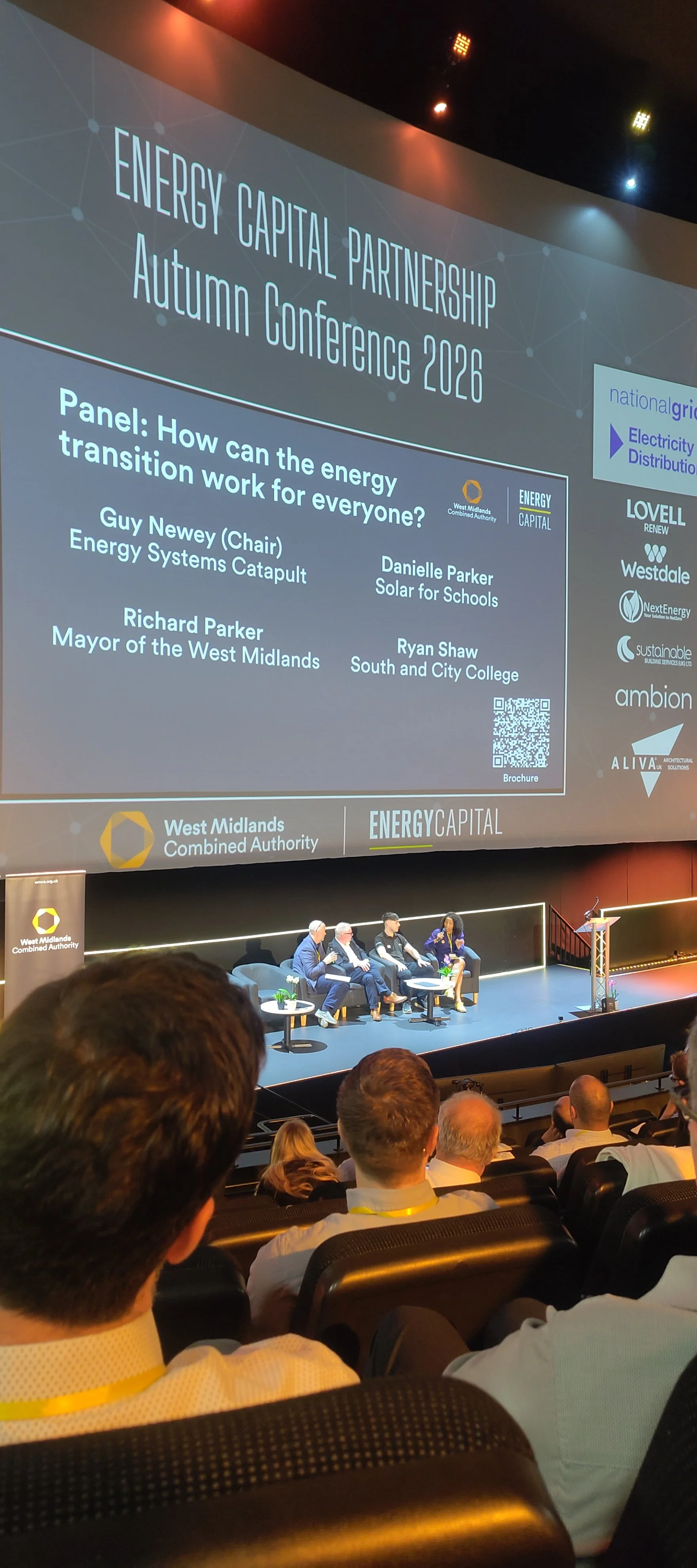  Photo of panel discussion with Guy Newey (Energy Systems Catapult), Richard Parker (Mayor of West Midlands), Danielle Parker (Solar for Schools) and Ryan Shaw (student at South and City College) 