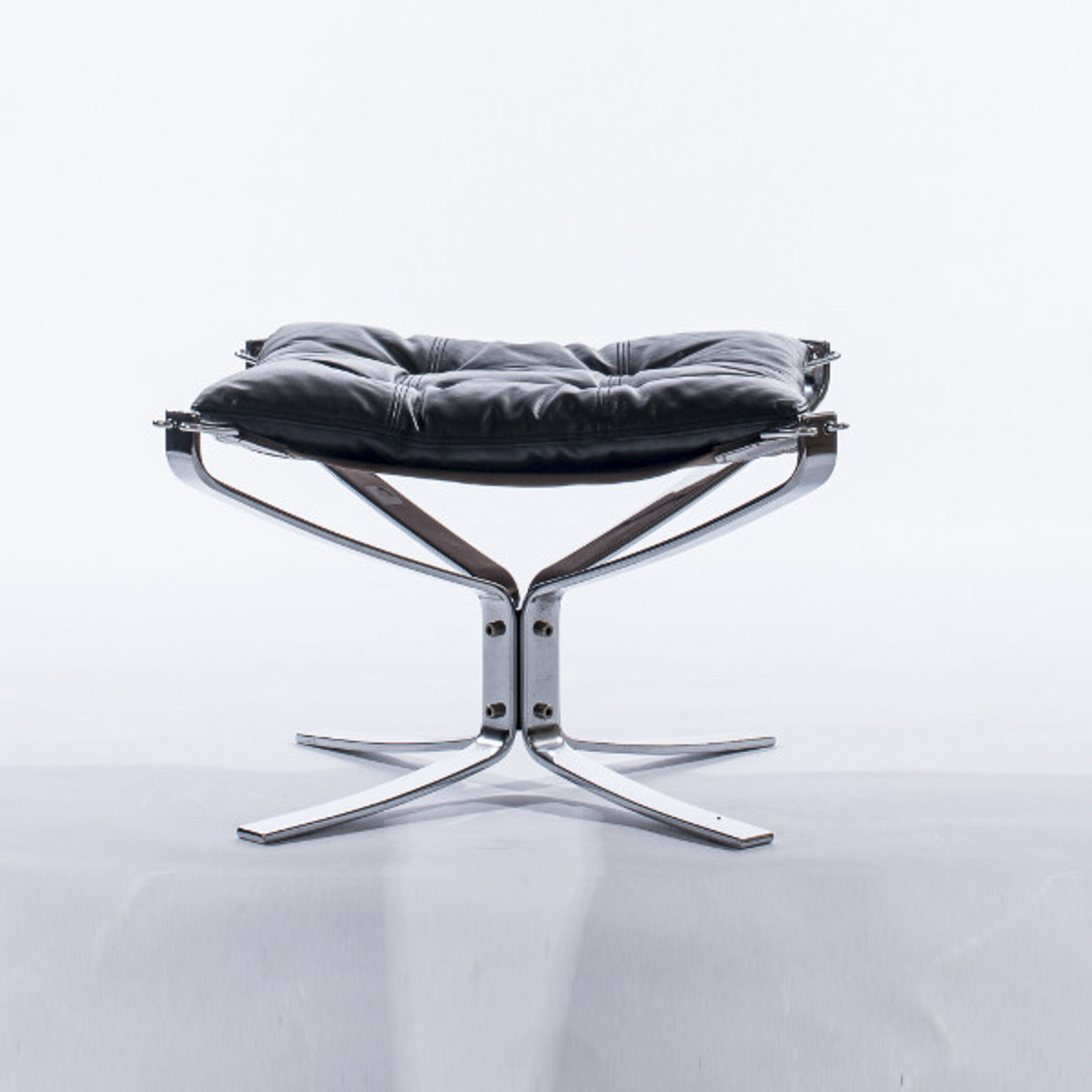 Falcon-Stool-Chrome-Black-on-Brown-Angle.jpg