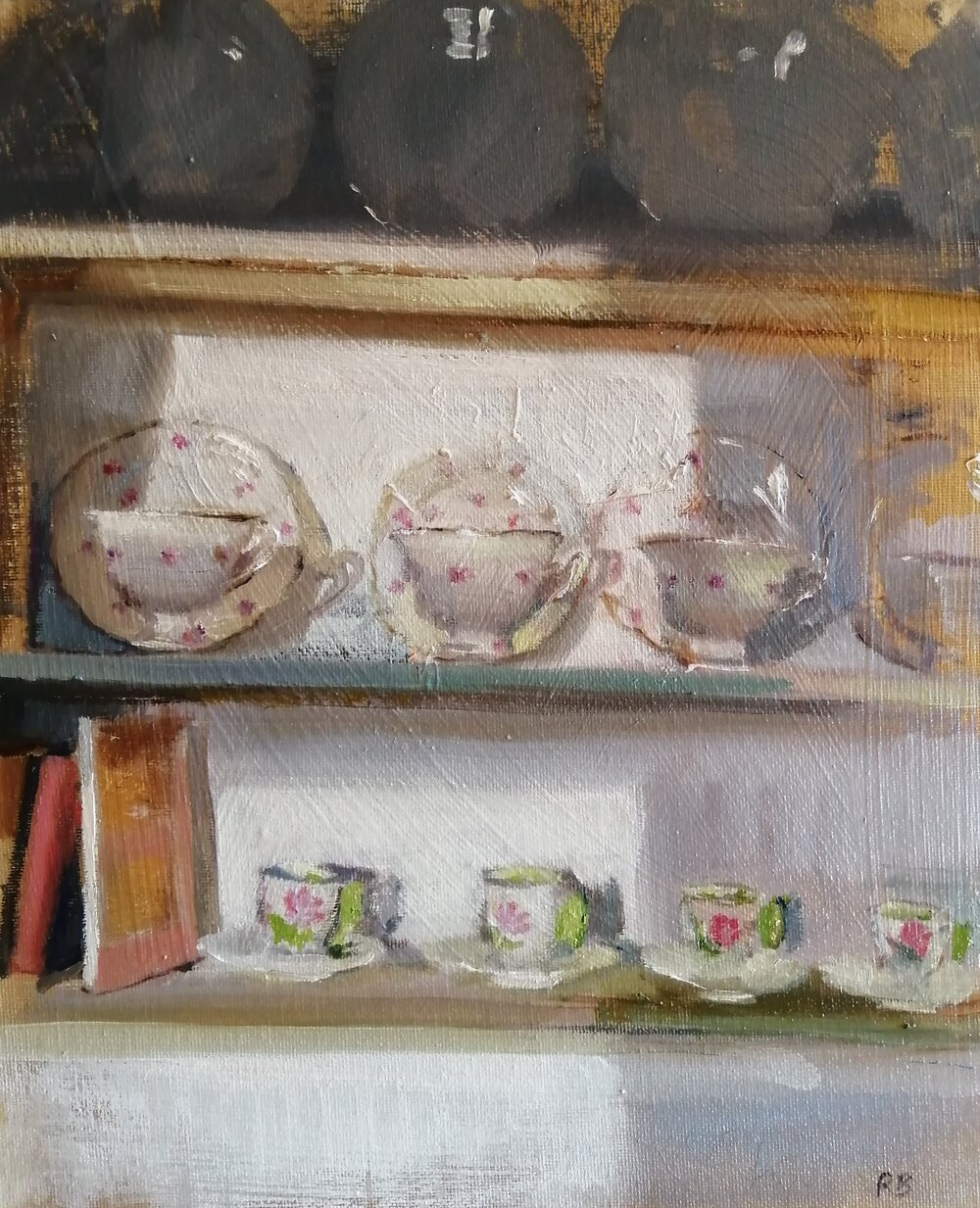  Cups  Oil on board  26x31 cm  £350  Cups and books on shelves - an everyday sight made interesting by the evening sunlight and shadows 