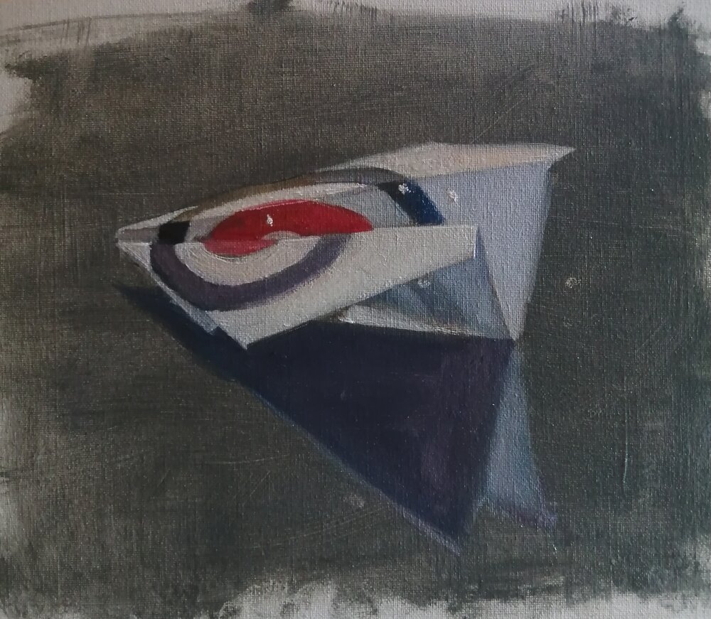  Target  Oil on board  31x26 cm  £375  A still life painting of a paper aeroplane made from a target 