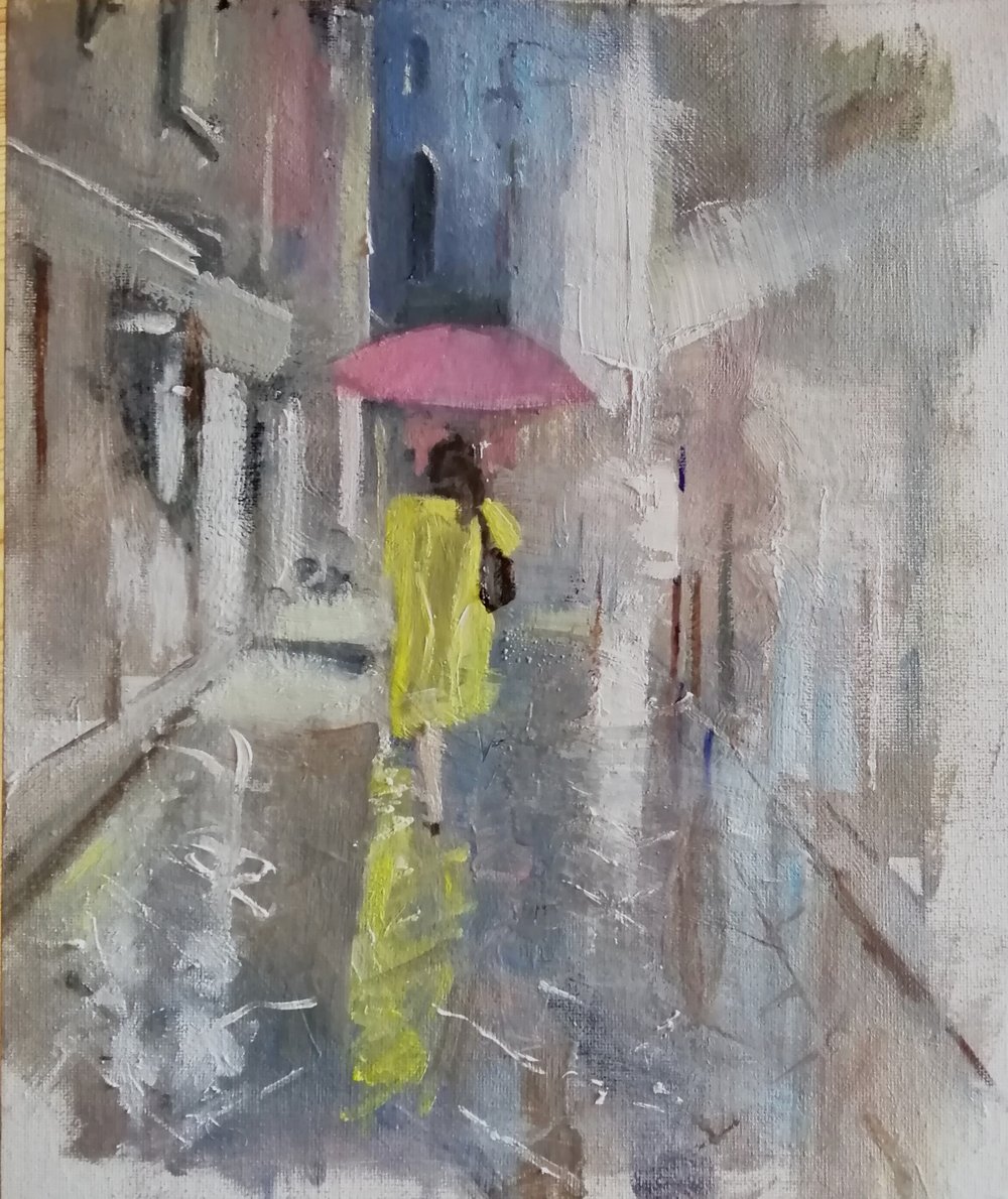  Yellow raincoat  Oil on board 26x31cm  £395  An impressionist painting of a woman wearing a yellow raincoat walking in the rain on a street in Venice. The lighting from the shops reflects and highlights the pattern on the wet paving, and there is co