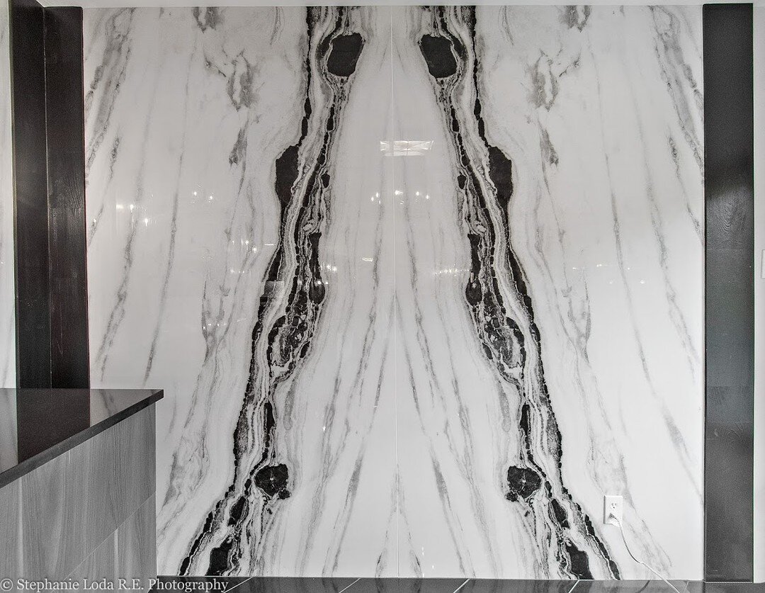 This wall is stunning and even better in person. Everyone who comes to the showroom always asks what the material is. Do you know?
It's a large format porcelain tile and it's a show stopper.
For more information on different types of stone head to ou