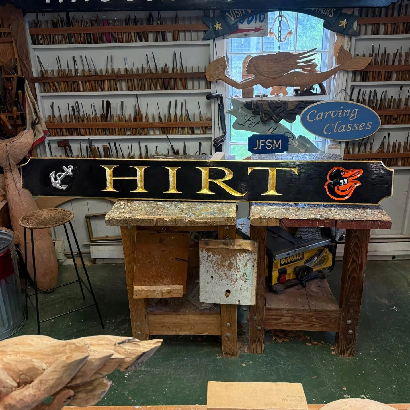 A hand carved sign is a sign of quality. 
Here&rsquo;s one I just finished  for a Baltimore Oriole fan. It is a  six footer with relief carved logo and fouled anchor, with incised letters gilded in 23.75k goldleaf. 
Interested in placing an order? Ch