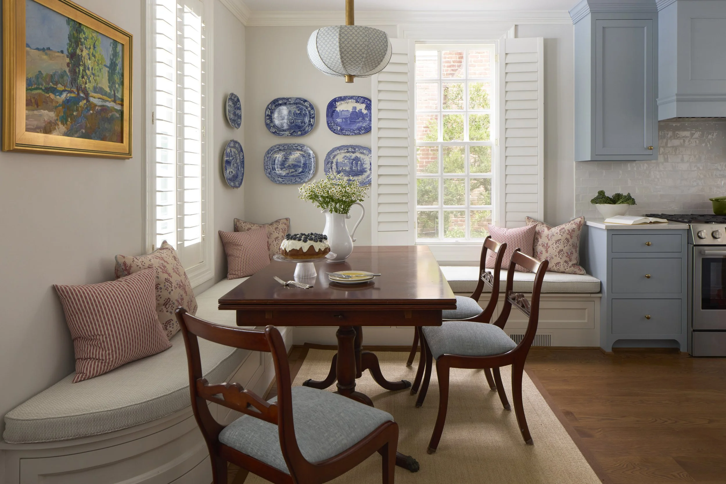 Historic Dining room in Richmond, VA, custom curved bench, bespoke lighting, blue cabinetry