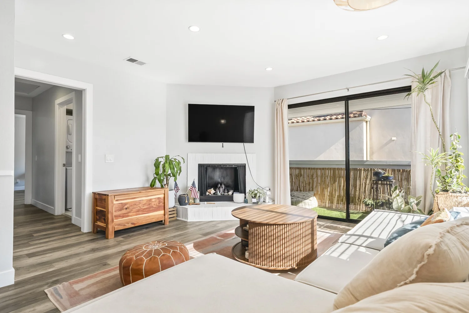 Living room with fireplace and sliding door to the balcony