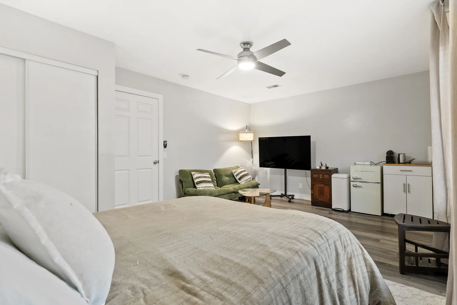 Bedroom with closet, TV and sitting area