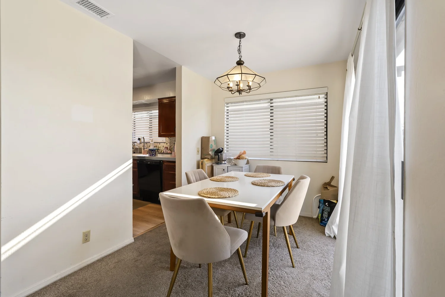 Dining area with pendant light next to the kitchen