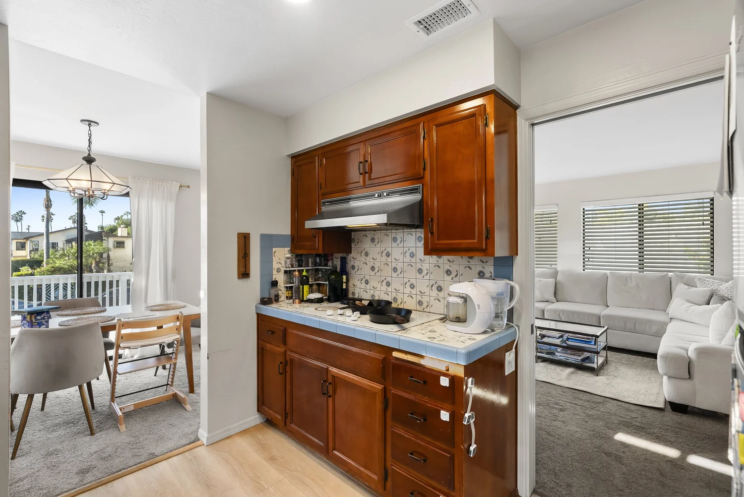Kitchen opening to the dining and living areas