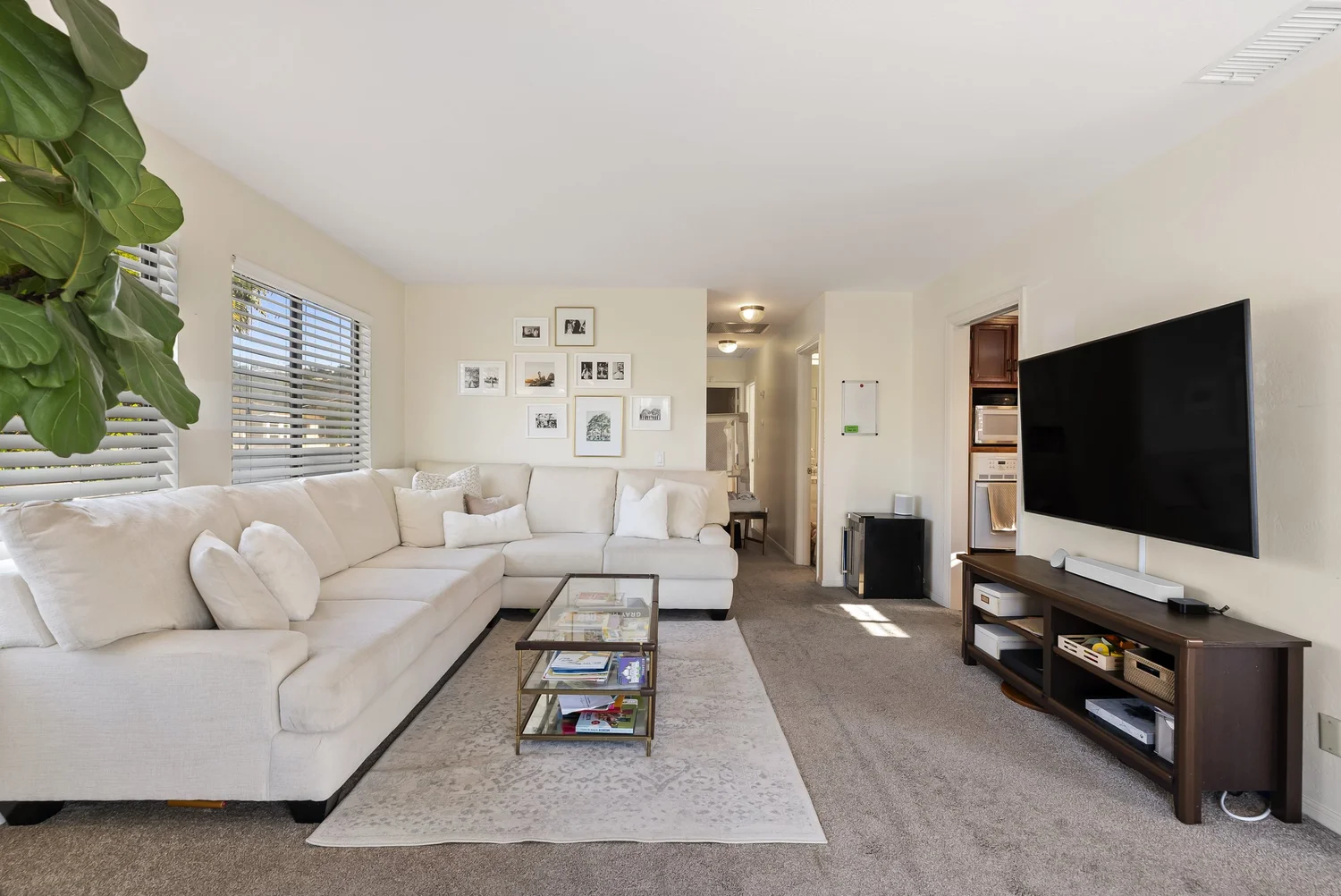 Living room with sectional sofa and media wall