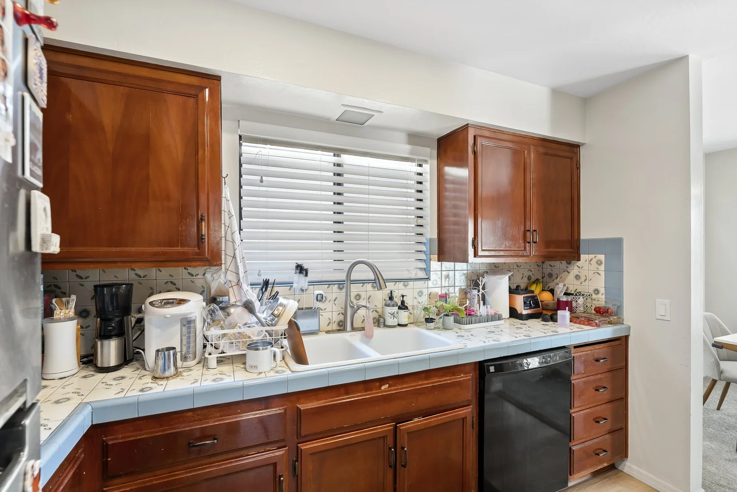 Kitchen counters with wood cabinets and dishwasher
