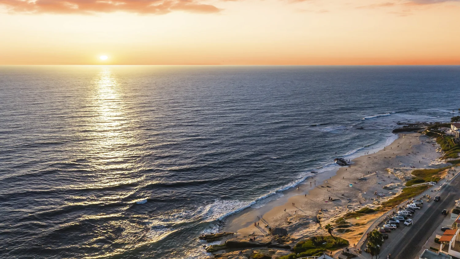 Sunset aerial of the La Jolla shoreline and beach, a short walk from Nautilus St