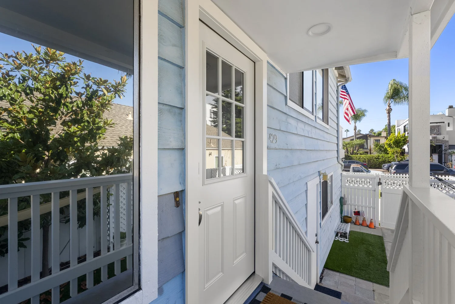 Covered entry porch of the front home