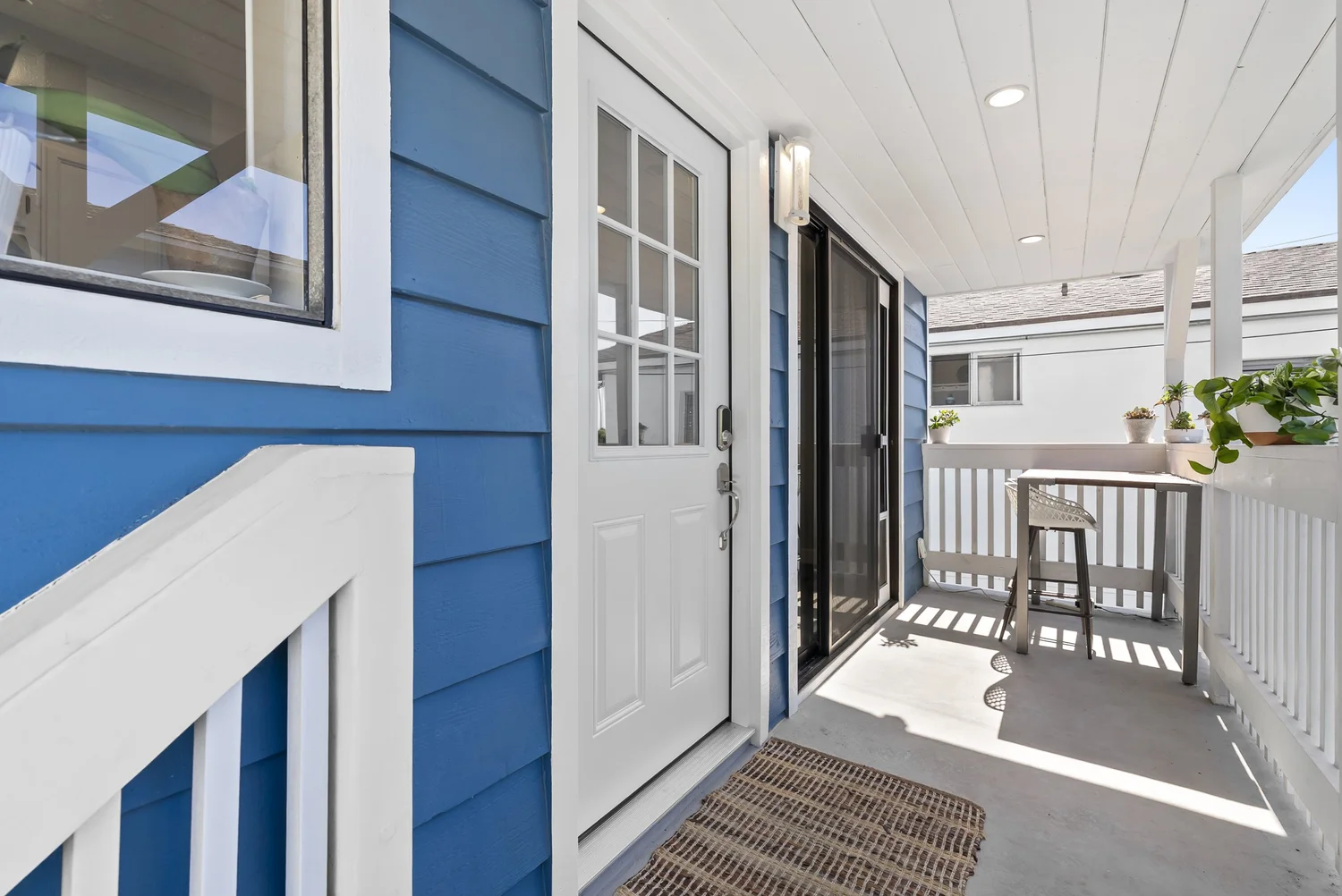 Covered porch at the rear home entry