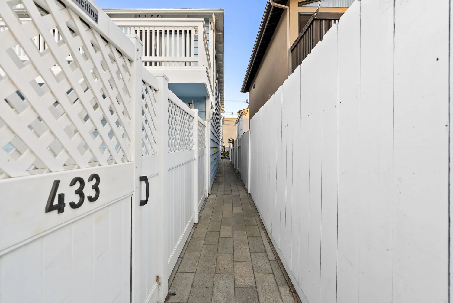 Paver walkway to 433 Nautilus St, the rear home