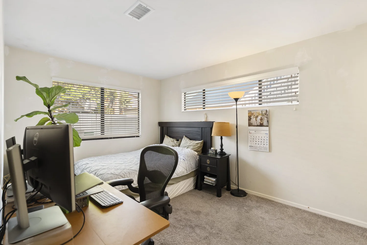 Bedroom with bed and work desk