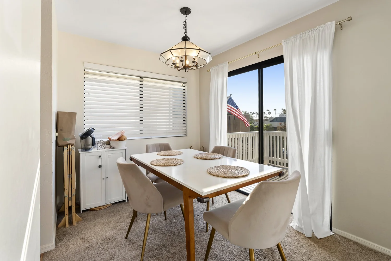 Dining table with pendant light and sliding door to the balcony