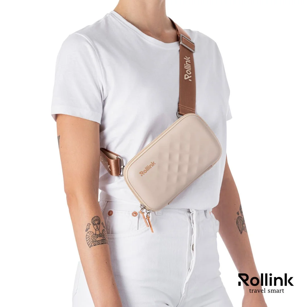 Woman wearing a beige Rollink Tour Mini Bag as a hip sling, side view