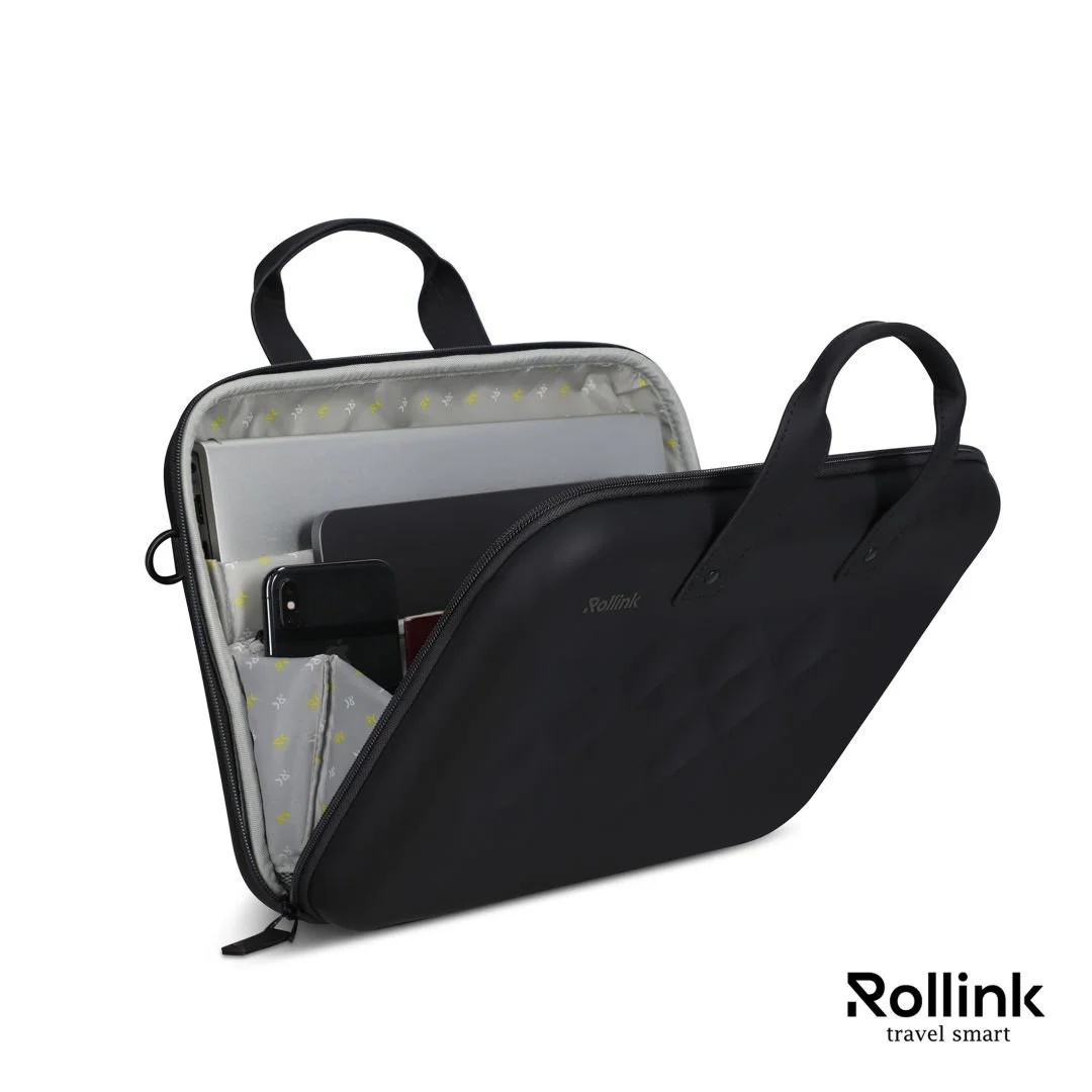 Open black Rollink Tour laptop case showing the padded laptop compartment and organizer pockets