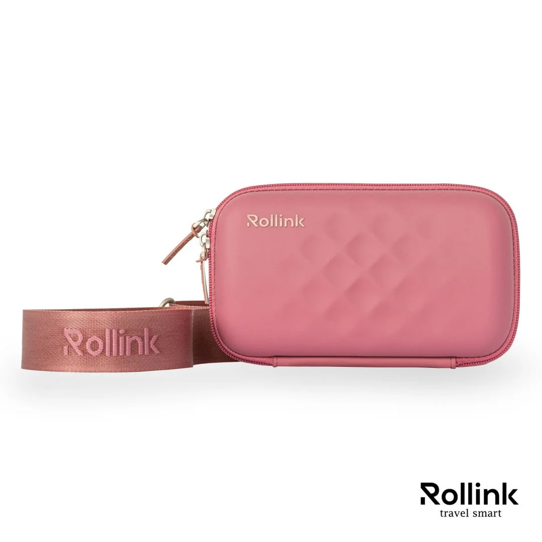 Pink Rollink Tour Mini Bag hard shell travel bag with woven strap, angled view