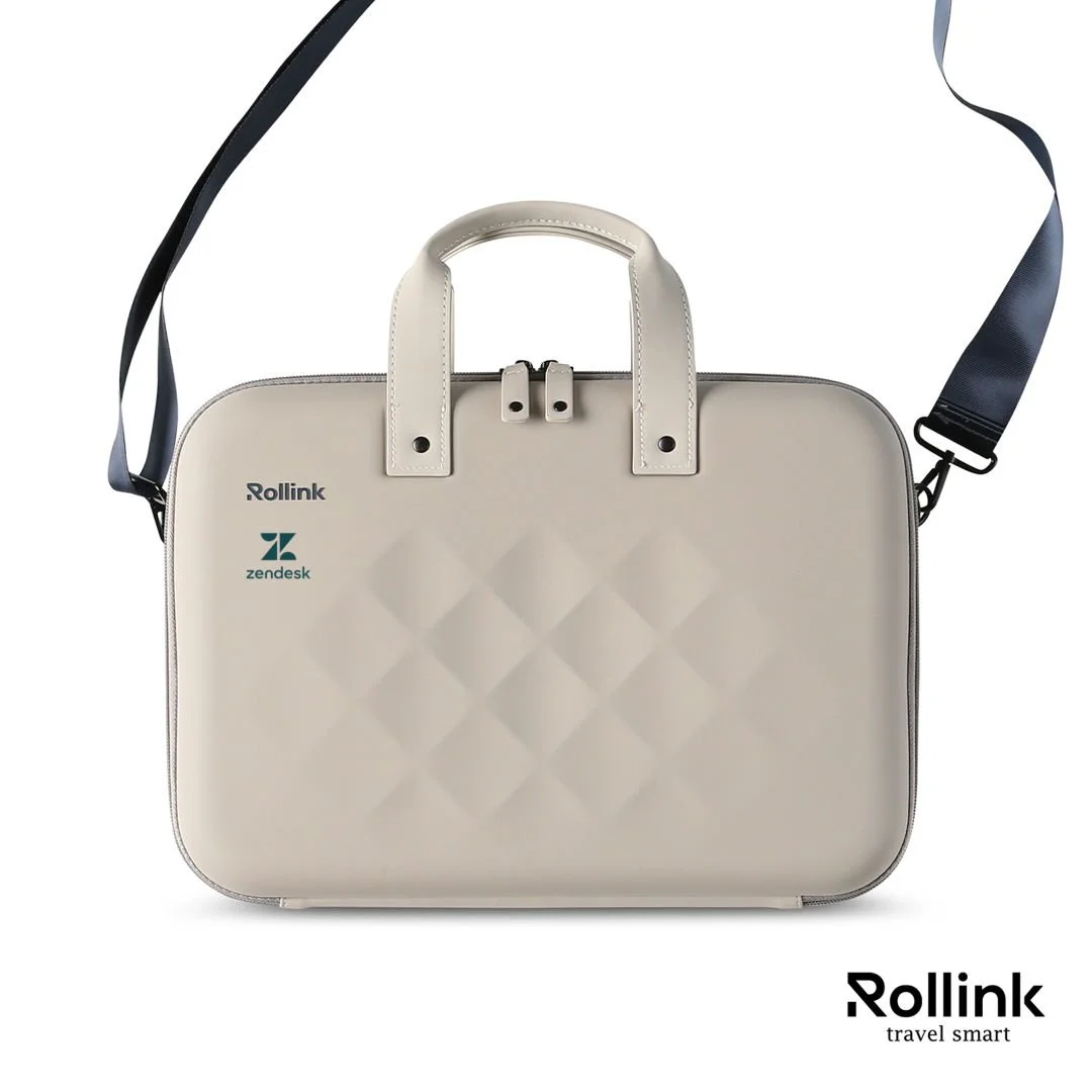 Beige Rollink Tour 15.6 inch horizontal hard shell laptop case with carry handles, shoulder strap and a logo on the front