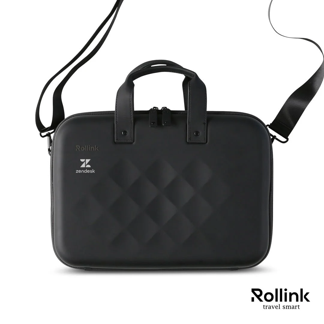 Black Rollink Tour 15.6 inch horizontal hard shell laptop case with carry handles and detachable shoulder strap