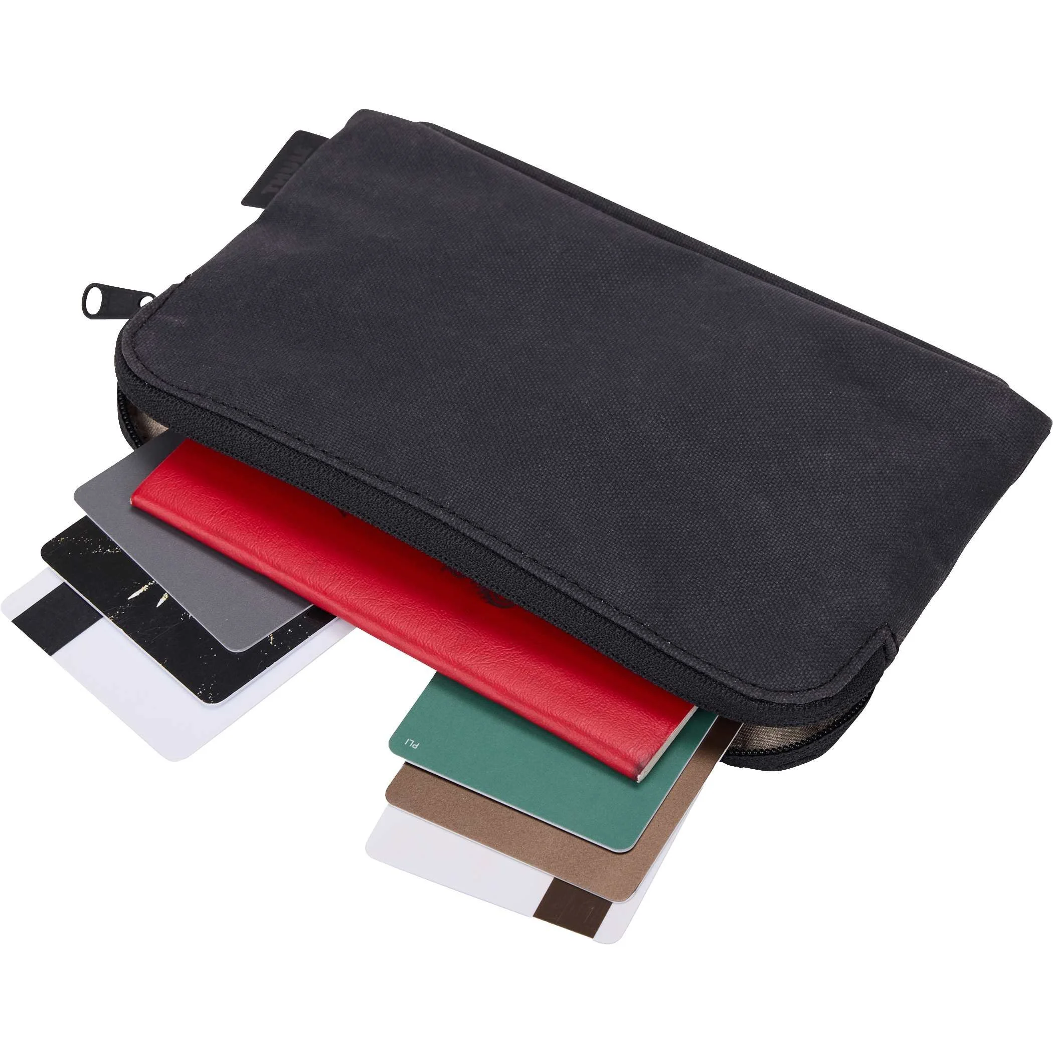 Detachable Thule Aion pouch with cards and passports sliding out