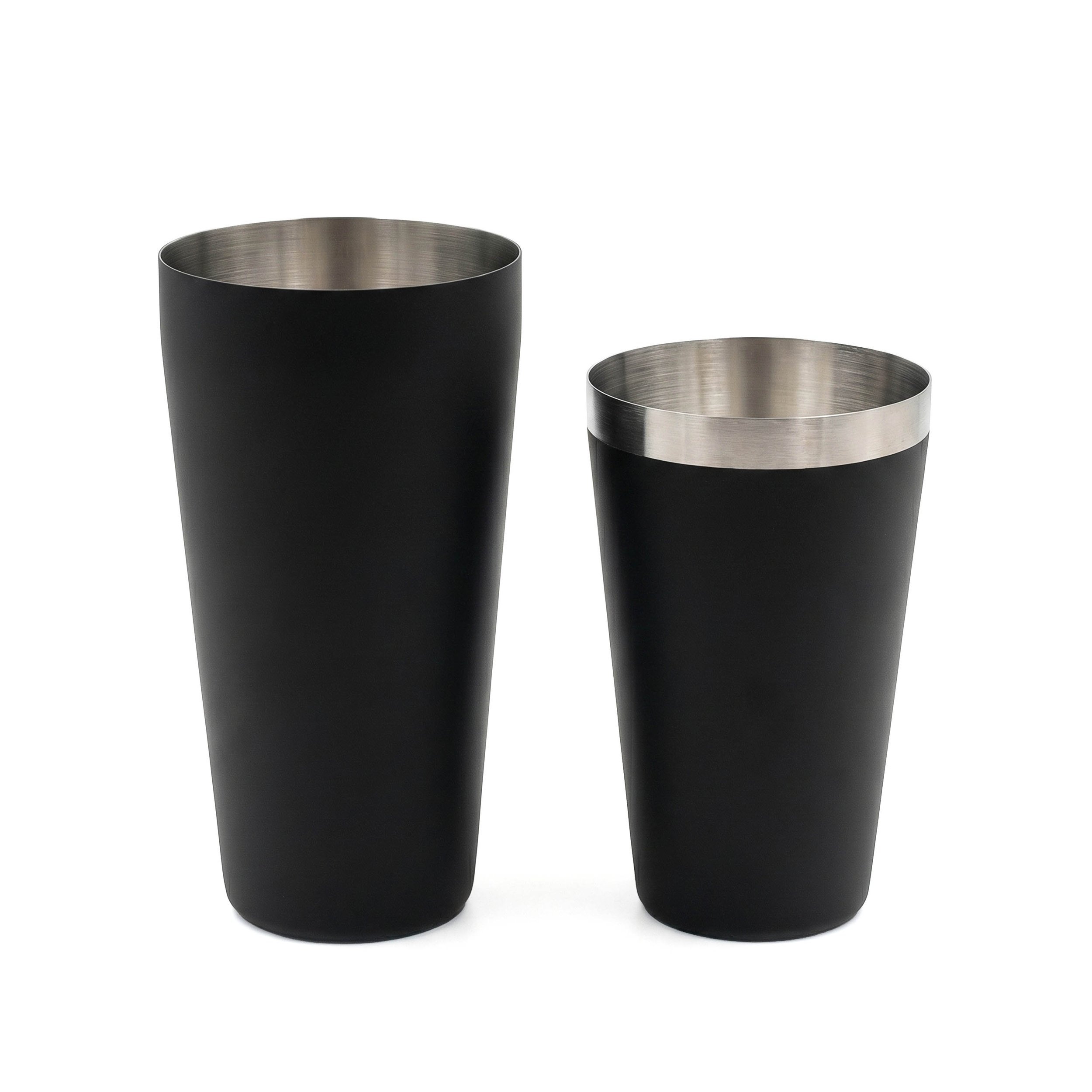 Two-piece Boston shaker separated to show the polished stainless steel tin nested beside its matte black outer cup.