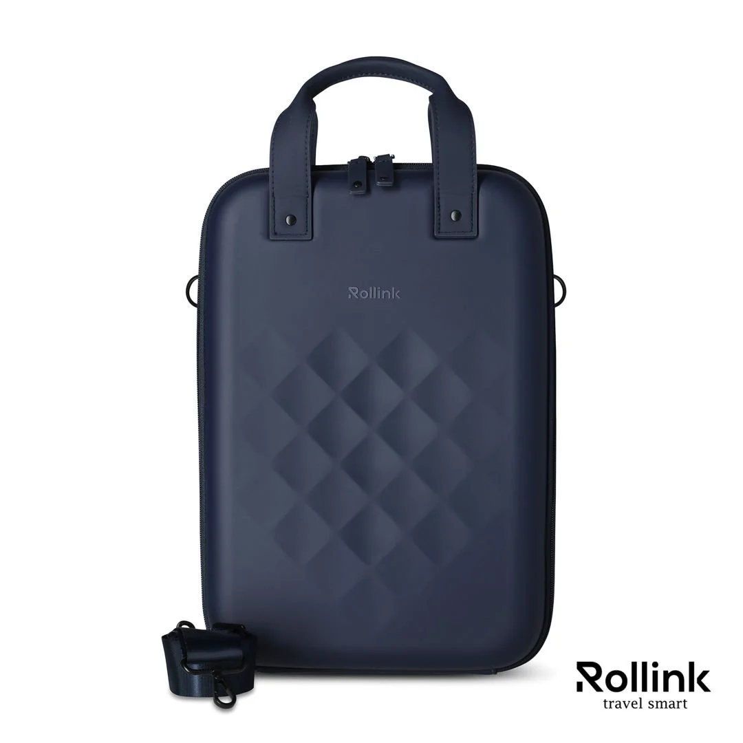 Navy Rollink Go vertical hard shell laptop case with quilted texture and strap clipped to the side
