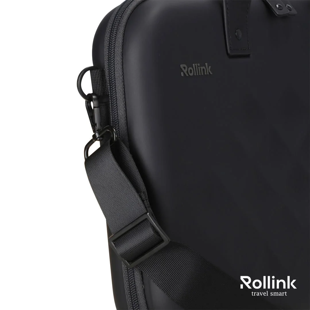 Close-up of a black Rollink Tour hard shell laptop case with shoulder strap attached