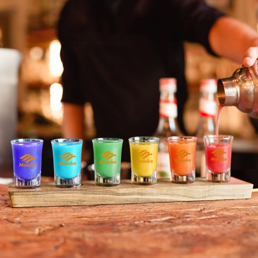 Shot Glasses Set on Acacia | Custom Gift Sets – colorful shot glasses lifestyle shot at bar counter