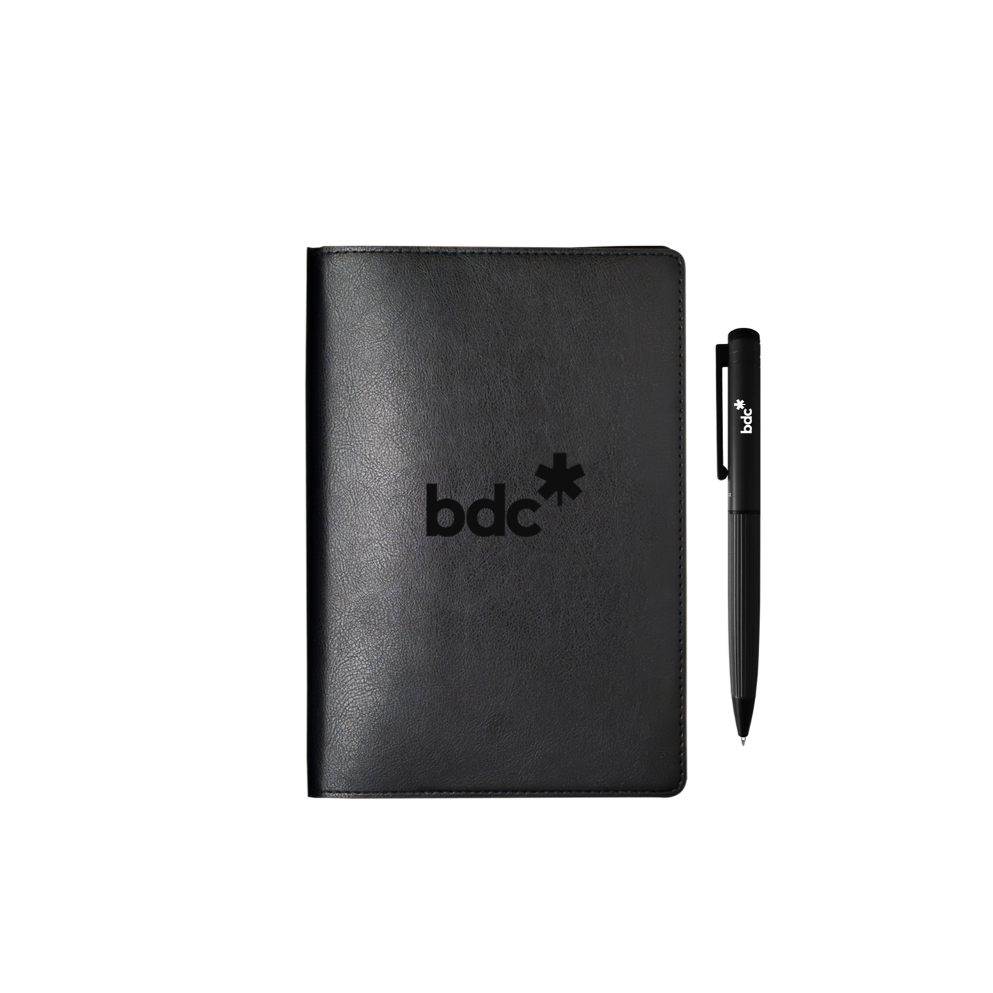 Closed black journal standing upright with its engraved logo on the cover, twist pen leaning against it, no box in view.