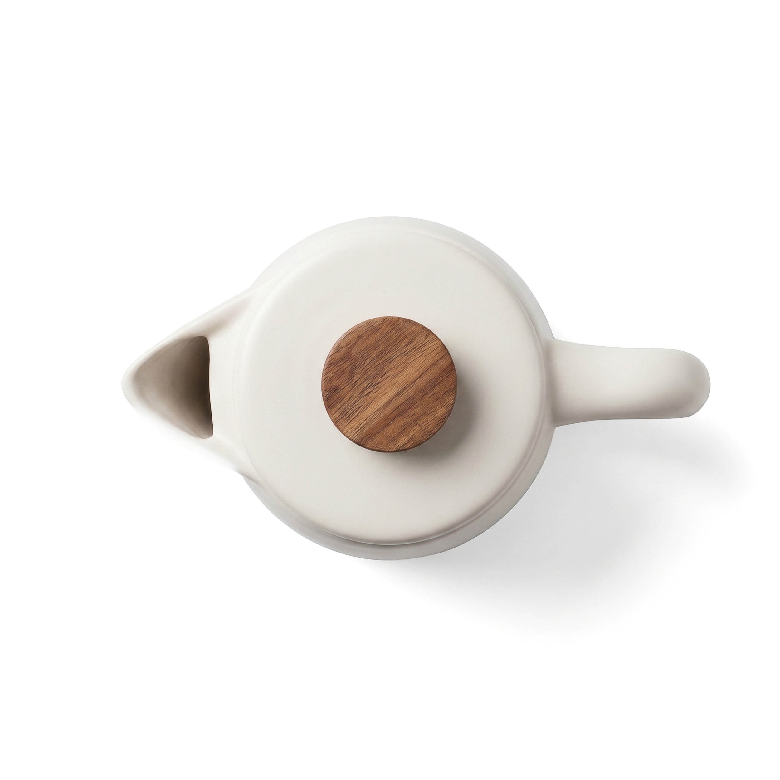 Overhead view of the kettle's spout and round wood-topped lid knob, angled to show the curved handle beside it.