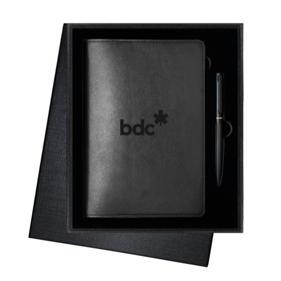 Black leather journal with a laser-engraved logo and matching pen resting inside an angled open gift box, a favourite for Ontario corporate orders.